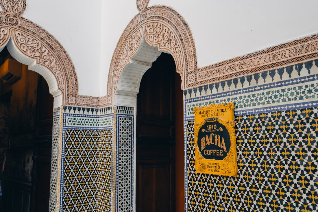 Ornate moroccan tiles with a bachir coffee sign.