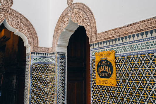 Ornate moroccan tiles with a bachir coffee sign.